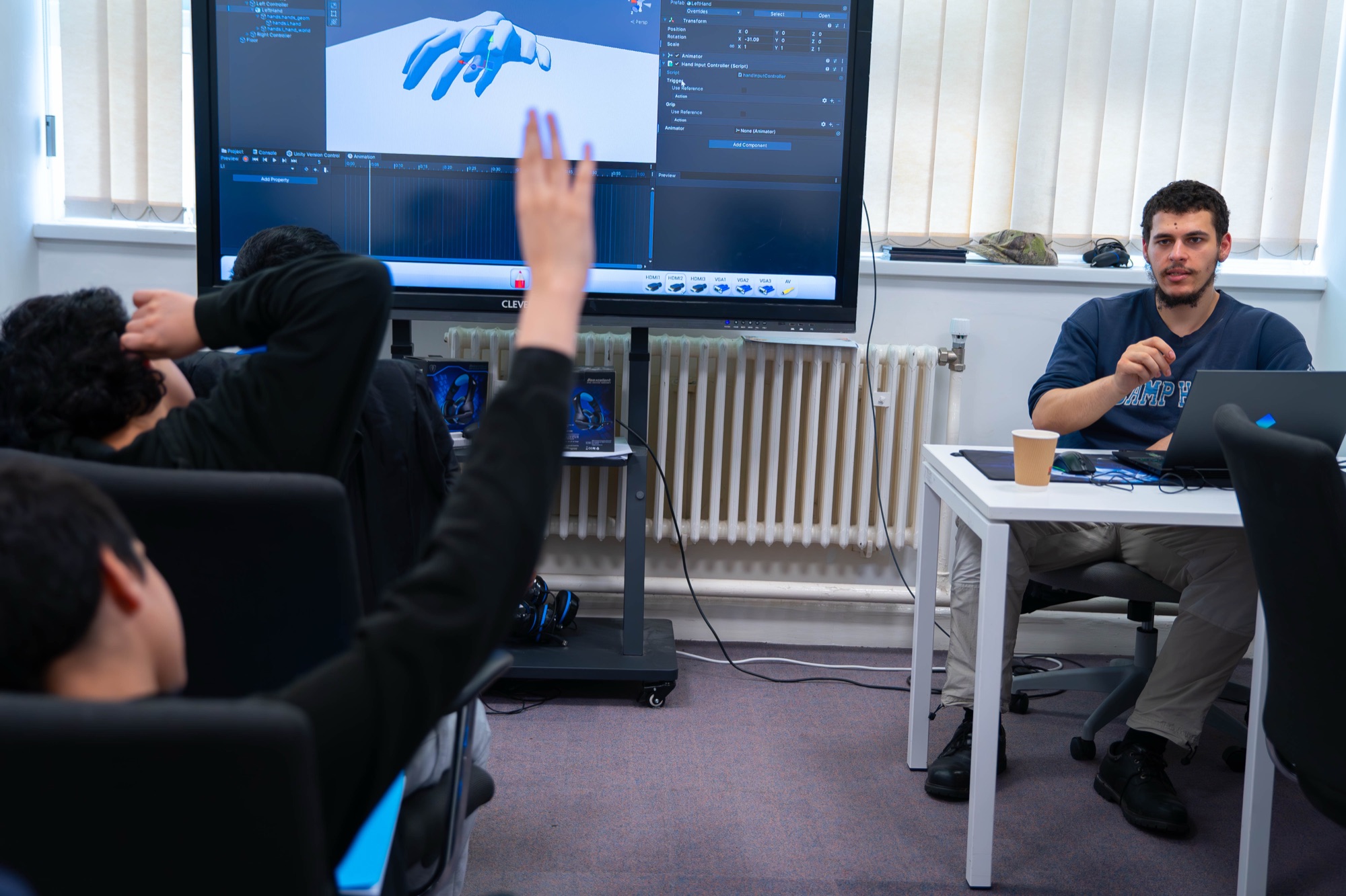 A Unity teaching session in the Shirley Studio Lab, Robocoder asks a question, Mentor responds.